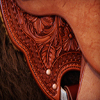 Vaquera Wade (Cowgirl Wade) with Sheridan Style Floral tooling, 15 and 1/2 inch seat, Gullet - 7 and 1/2 inch by 6 and 1/4 inch by 4 inch, Horn  3 X 4 inch round, 90 degree bars, 7/8ths In skirt riggin, 1 and 1/4 inch Cheyenne Roll, Sheridan Styl Floral with Vaquero border half breed combination.  Cowgirl Tough!!  Contact us about a saddle made just for you like this one.